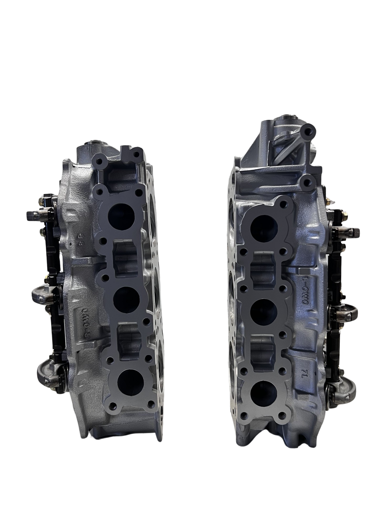Exhaust side of cylinder head for a Nissan 3.3L SOHC Casting #OWO VG33E (SOLD IN PAIR)